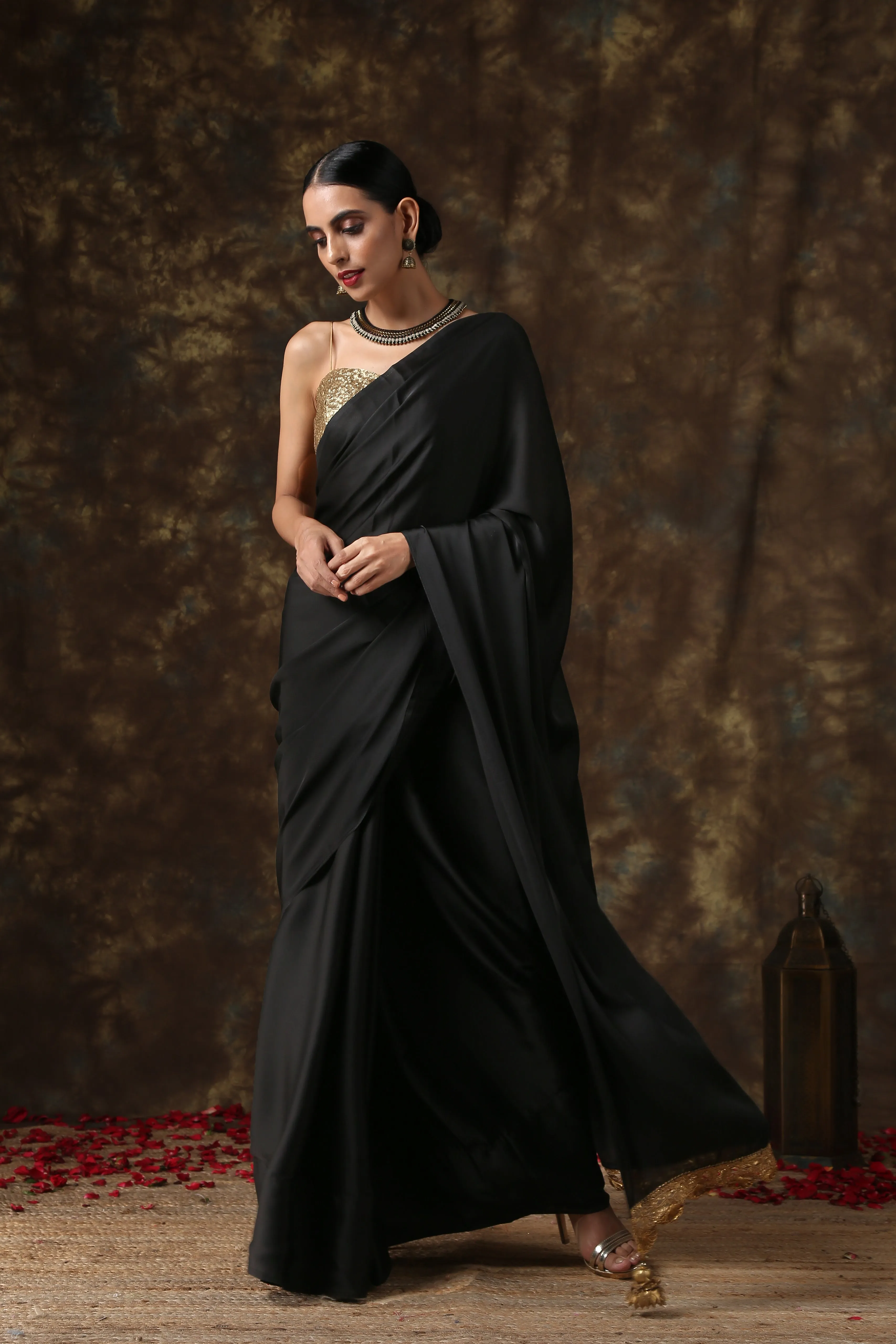 Luxurious Black Satin Saree with Dull Gold Lace and Pendants